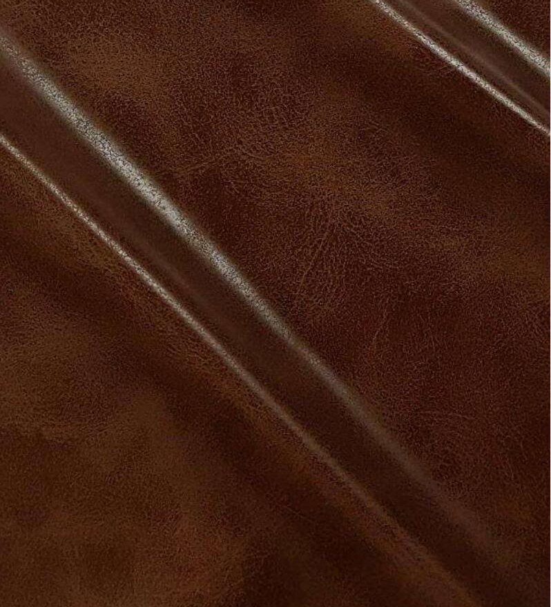 Close-up de couro sintético Kansas castanho quente com textura fiel ao couro bovino